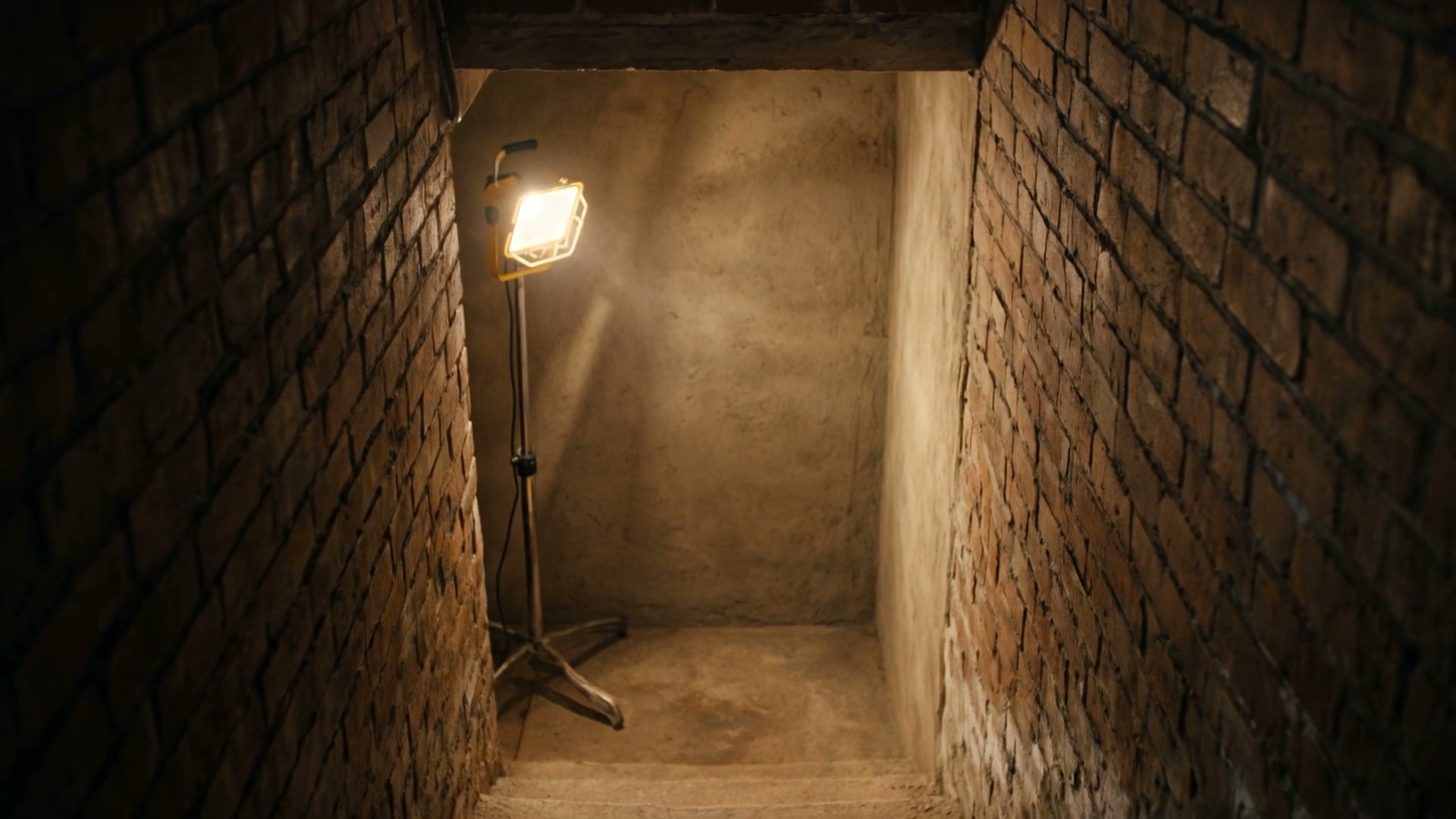 Cellar wall made sound, lit by a work lamp, illustration
